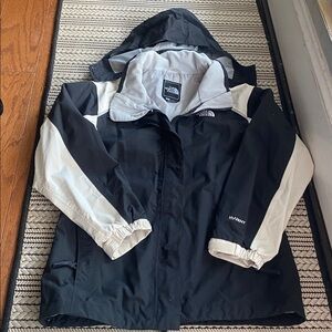 The North Face girl’s black and white jacket size large EUC